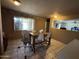 Bright dining area with tile flooring and natural light, perfect for enjoying meals with Gathering and friends at 3937 W Stella Ln, Phoenix, AZ 85019