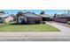 Charming single-Gathering home with a well-maintained lawn and mature landscaping, complemented by a long driveway at 3937 W Stella Ln, Phoenix, AZ 85019