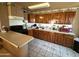 Spacious kitchen featuring a gas range, ample storage, and tile flooring, ideal for cooking and entertaining at 3937 W Stella Ln, Phoenix, AZ 85019