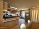 Well-equipped kitchen with tile flooring, generous counter space, and wooden cabinets, perfect for culinary endeavors at 3937 W Stella Ln, Phoenix, AZ 85019