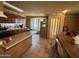 Functional kitchen with a breakfast bar, ample cabinet space, and a cozy dining area for Gathering meals at 3937 W Stella Ln, Phoenix, AZ 85019