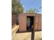 This storage shed has double doors and contains various stored items. It is in a backyard at 3937 W Stella Ln, Phoenix, AZ 85019