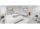 Bright and airy main bedroom with neutral tones, featuring a queen bed and minimalist decor at 3944 E Ghost Flower Ln, San Tan Valley, AZ 85140