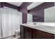 Bathroom featuring a purple wall, vanity, and a shower with a patterned curtain at 40913 W Williams Way, Maricopa, AZ 85138