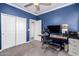 Office with blue walls, ceiling fan, desk, and carpet at 40913 W Williams Way, Maricopa, AZ 85138