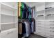 Walk-in closet with custom shelving and plenty of space for storage at 40913 W Williams Way, Maricopa, AZ 85138