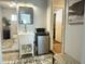 Quaint bathroom boasts a vintage sink, adjacent mini-fridge, and is conveniently located near doorway at 433 S 113Th Pl, Mesa, AZ 85208