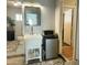 Quaint bathroom boasts a vintage sink, adjacent mini-fridge, and is conveniently located near doorway at 433 S 113Th Pl, Mesa, AZ 85208