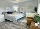 Well-decorated bedroom with a cozy area rug, seating area, and lots of natural light at 433 S 113Th Pl, Mesa, AZ 85208