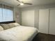Bedroom featuring a ceiling fan, large closet, and wood flooring at 433 S 113Th Pl, Mesa, AZ 85208