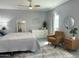 Bright bedroom featuring a queen bed, area rug, ceiling fan, and contemporary decor at 433 S 113Th Pl, Mesa, AZ 85208