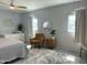 A serene bedroom features large windows and tranquil décor for relaxation at 433 S 113Th Pl, Mesa, AZ 85208