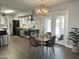 Open kitchen and dining area featuring modern pendant lighting and stainless steel appliances at 433 S 113Th Pl, Mesa, AZ 85208