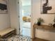 Bright view through the home's entry showing a cozy bedroom at 433 S 113Th Pl, Mesa, AZ 85208