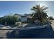 Quaint single story home with desert landscaping, a fire hydrant, and mature palm tree on a sunny day at 433 S 113Th Pl, Mesa, AZ 85208