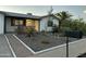 Charming single story home with gravel landscaping and a decorative white border and mature tree at 433 S 113Th Pl, Mesa, AZ 85208