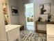Hallway featuring modern decor, view into adjacent room, and stylish accents at 433 S 113Th Pl, Mesa, AZ 85208