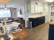 Bright eat-in kitchen featuring custom cabinetry, butcher block countertops, and stainless steel appliances at 433 S 113Th Pl, Mesa, AZ 85208