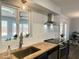 Bright kitchen featuring a modern faucet, sleek countertops, and stainless steel appliances at 433 S 113Th Pl, Mesa, AZ 85208