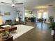 Open floor plan shows living room and view to modern kitchen and dining area at 433 S 113Th Pl, Mesa, AZ 85208