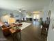 Spacious living room with wood look floors and an open floor plan to the kitchen at 433 S 113Th Pl, Mesa, AZ 85208