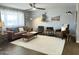 Inviting living room with hardwood floors, plush rug, and stylish contemporary decor at 433 S 113Th Pl, Mesa, AZ 85208