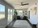 Bright sun room with sliding glass doors, modern chairs and decorative rug at 433 S 113Th Pl, Mesa, AZ 85208