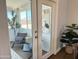 Cozy sun room with stylish decor, modern chairs and view to fenced backyard at 433 S 113Th Pl, Mesa, AZ 85208