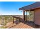 Expansive wooden balcony with steel details and an amazing view of the valley at 4925 E Red Rock Dr # 43, Phoenix, AZ 85018