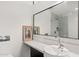Modern bathroom features a vessel sink, large mirror, and a view of the glass door shower at 4925 E Red Rock Dr # 43, Phoenix, AZ 85018
