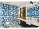 Bathroom featuring bold blue cactus wallpaper, decorative art and white sink basin at 4925 E Red Rock Dr # 43, Phoenix, AZ 85018