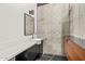 Modern bathroom featuring sleek vanity, concrete wall, and custom millwork at 4925 E Red Rock Dr # 43, Phoenix, AZ 85018