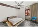 Bright bedroom features a modern ceiling fan, neutral decor, and a window with views, creating a peaceful retreat at 4925 E Red Rock Dr # 43, Phoenix, AZ 85018
