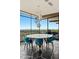 Dining room with valley views, modern chandelier and unique stone floors at 4925 E Red Rock Dr # 43, Phoenix, AZ 85018