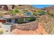 Modern home with an outdoor pool and lounge area cantilevered over a dramatic red rock landscape at 4925 E Red Rock Dr # 43, Phoenix, AZ 85018