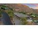 Scenic view of the home featuring a rooftop pool and large driveway nestled in the mountain at 4925 E Red Rock Dr # 43, Phoenix, AZ 85018