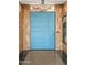 Front door with wood paneling, unique light fixture and concrete-style flooring at 4925 E Red Rock Dr # 43, Phoenix, AZ 85018