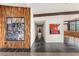 Wide hallway displays modern artwork and leads to an inviting living area with natural light and scenic views at 4925 E Red Rock Dr # 43, Phoenix, AZ 85018