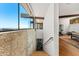 The interior view shows the staircase, large windows with a view, and an open space used as an exercise area at 4925 E Red Rock Dr # 43, Phoenix, AZ 85018