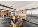 Contemporary kitchen boasts wood cabinets, stainless appliances, and expansive island at 4925 E Red Rock Dr # 43, Phoenix, AZ 85018
