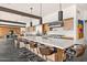 Bright kitchen with expansive island, stone floors, modern cabinets, and stainless appliances at 4925 E Red Rock Dr # 43, Phoenix, AZ 85018