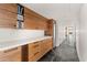Modern kitchen offers ample storage with sleek wooden cabinets, white countertops, and a wine fridge at 4925 E Red Rock Dr # 43, Phoenix, AZ 85018