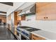 Kitchen features an oversized range, stone countertops, and modern cabinets at 4925 E Red Rock Dr # 43, Phoenix, AZ 85018
