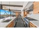Kitchen features an oversized island, stone countertops, and stainless appliances at 4925 E Red Rock Dr # 43, Phoenix, AZ 85018