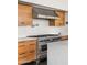 Kitchen showcasing stainless steel range and hood and marble countertops at 4925 E Red Rock Dr # 43, Phoenix, AZ 85018