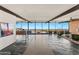 Bright living room featuring stone floors, modern furniture, and large sliding glass doors at 4925 E Red Rock Dr # 43, Phoenix, AZ 85018