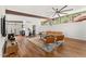 Spacious living room with hardwood floors, beamed ceilings, modern furniture, and a view of the outdoors at 4925 E Red Rock Dr # 43, Phoenix, AZ 85018
