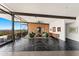 Elegant living room with modern furniture and floor to ceiling window views of the mountain landscape at 4925 E Red Rock Dr # 43, Phoenix, AZ 85018