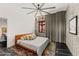 This main bedroom features a modern ceiling fan, view of rock formations, and sleek, decorative elements at 4925 E Red Rock Dr # 43, Phoenix, AZ 85018