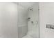 This shower features white mosaic tiles, a built-in niche, and a glass enclosure for a clean, modern look at 4925 E Red Rock Dr # 43, Phoenix, AZ 85018